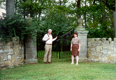 Iron gate entrance to Howard's Grove Cemetery. 
Samuel W. Thomas (author of many books, including Cave Hill Cemetery, A Pictorial Guide and its History) is on the left; 
Randolph Hollingsworth (Lexington Community College professor) is on the right.  This picture was taken by Jim 
Birchfield, August 1997.  Posted April 6, 1998